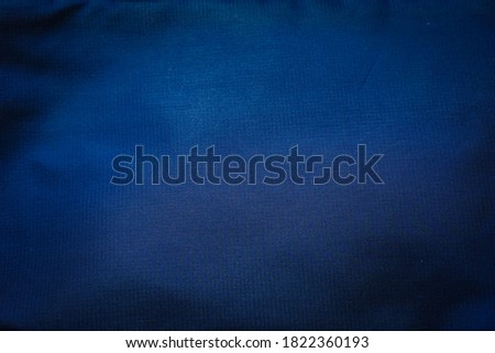 surface of navy blue fabric for background.