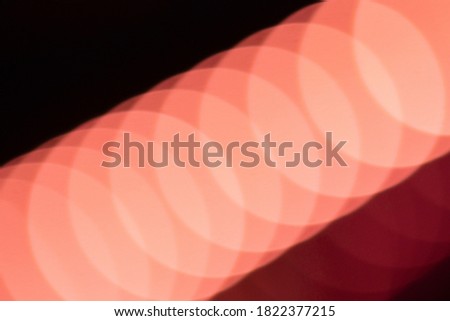 Abstract light background. Pink blured trail lights and bokeh. Beautiful motion painting. Long exposure photography