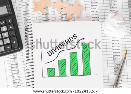 Notebook with Toolls and Notes about Dividends. Royalty-Free Stock Photo #1822415267