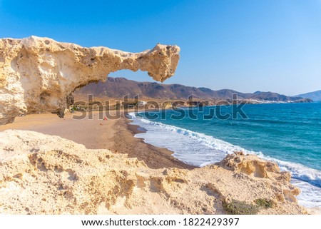 Precious rock on the Playa los Escullos in the natural park of Cabo de Gata, Nijar, Andalucia. Spain, Mediterranean Sea Royalty-Free Stock Photo #1822429397