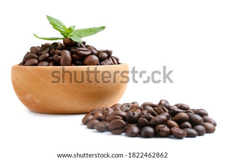Bowl of ground coffee and beans isolated on white background