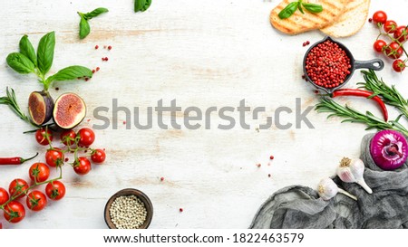 Cooking banner. Background with spices and vegetables. Top view. Free space for your text. Royalty-Free Stock Photo #1822463579
