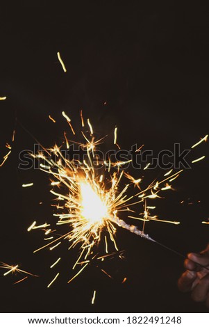 A fire sparkler on black background