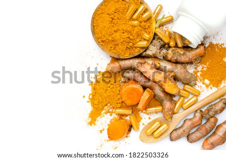 Group of organic curcumin or turmeric product consisted of powder in wooden bowl,capsule,and fresh with young sprout on white background, for health care or natural product concept