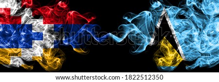 Nagorno-Karabakh, Artsakh vs Saint Lucia smoky mystic flags placed side by side. Thick colored silky abstract smoke flags