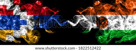 Nagorno-Karabakh, Artsakh vs Niger, Nigerian smoky mystic flags placed side by side. Thick colored silky abstract smoke flags