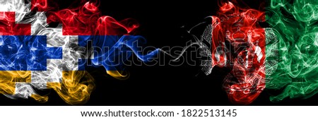 Nagorno-Karabakh, Artsakh vs Afghanistan, Afghani smoky mystic flags placed side by side. Thick colored silky abstract smoke flags