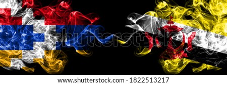 Nagorno-Karabakh, Artsakh vs Brunei, Bruneian smoky mystic flags placed side by side. Thick colored silky abstract smoke flags