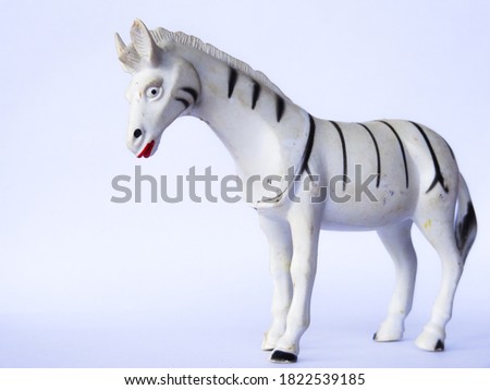 white zebra-shaped toy on white background