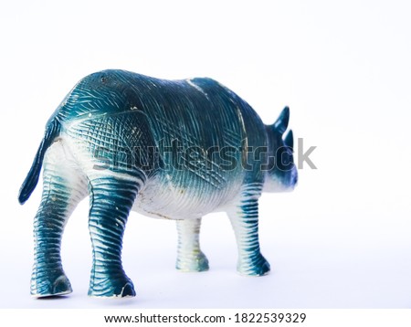 blue rhino shaped toy on white background