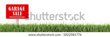 Sign with phrase GARAGE SALE in green grass on white background, banner design 