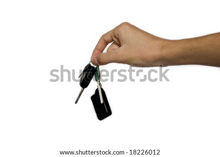 Hand and car key isolated on white background