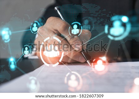 Businessman in suit signs contract. Double exposure with social media and planet hologram. Man signing agreement on research. People network concept.