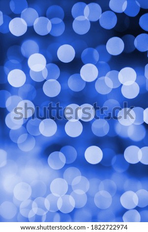 Background of blurry lights out of focus. Texture for decoration and graphic design. Blue.