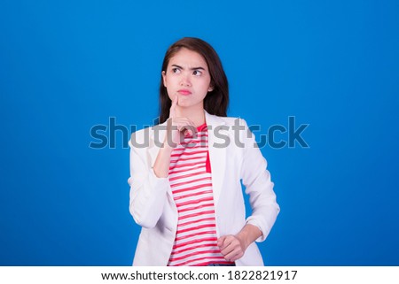 Portrait of a female executive with show a gesture on a blue background