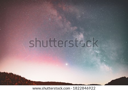 Milky Way, Jupiter and Saturn planets in the night sky.