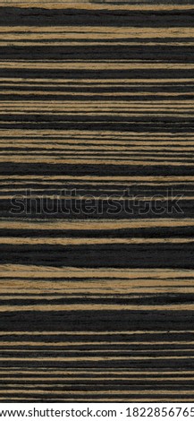 Wood grain texture. Ebony wood, can be used as background.