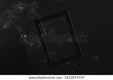 Black frame on a black monochrome background with white smoke around. Halloween background mock up