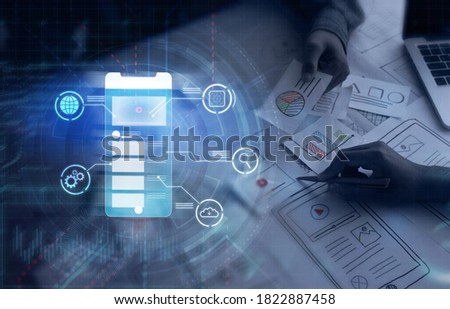 UX UI user interface design graphical futuristic icon with graphics designer planning sketch creating creative idea innovation teamwork planning strategy, using pen computer laptop modern technology 