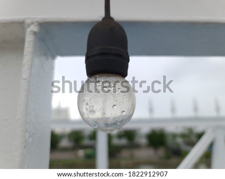 A light bulb with water droplets inside