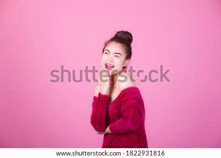 Portrait of beautiful asia young woman, on pink color background with copy space. Human face expressions, emotions feelings, body language,beauty and fashion concept.
