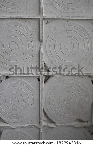 abstract round image on a concrete stone wall. for banners, business cards, labels, splash screens, signage