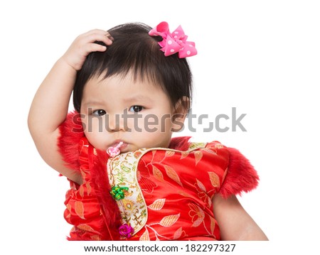 Chinese baby girl scratch her hair