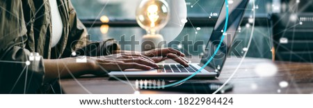 Close-up photo of female hands with laptop. woman working remotely at home. Concept of networking or remote work. Global business network. Online courses.