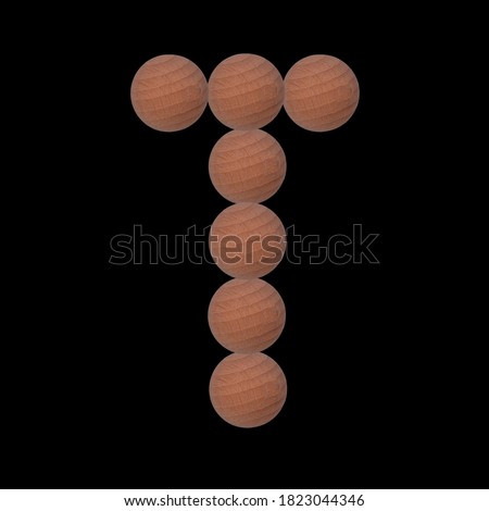 Letter of the alphabet made with circular wooden silhouettes. Isolated on black background