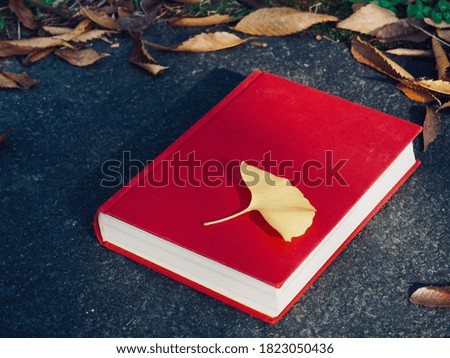 Red book and autumn maple, Ginkgo leaves