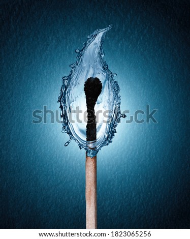 concept of a burned matchstick with a water drop flame on blue background Royalty-Free Stock Photo #1823065256