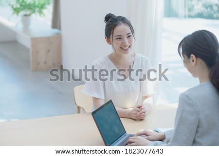 Meeting young asian women in the room. Consultant. Royalty-Free Stock Photo #1823077643