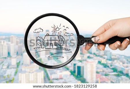 Drawing houses and magnifying glass. Search for housing and apartments concept
