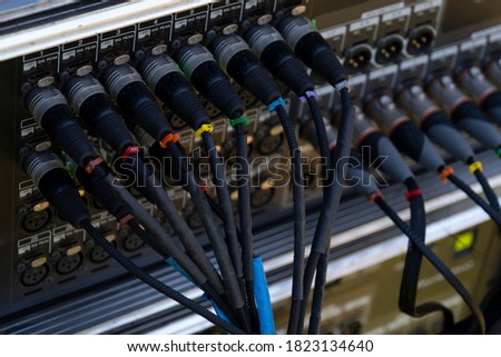 Audio snake and stage box with xlr cables and jacks at a live show
