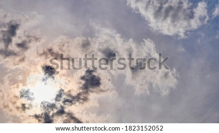 beautiful sun in the clouds. general plan. color