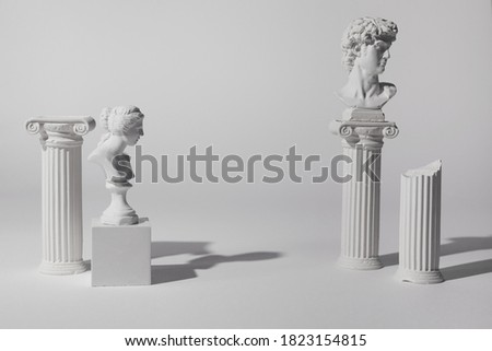 Background for product presentation. Antique columns ans statues on white background Royalty-Free Stock Photo #1823154815