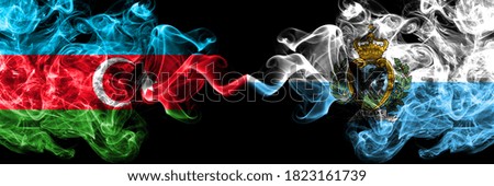 Azerbaijan, Azerbaijani vs San Marino, Sammarinese smoky mystic flags placed side by side. Thick colored silky abstract smoke flags