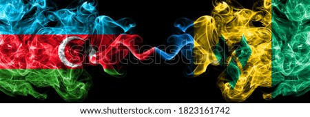 Azerbaijan, Azerbaijani vs Saint Vincent and the Grenadines smoky mystic flags placed side by side. Thick colored silky abstract smoke flags