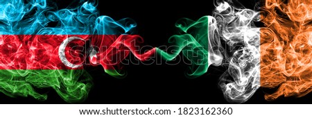 Azerbaijan, Azerbaijani vs Ireland, Irish smoky mystic flags placed side by side. Thick colored silky abstract smoke flags