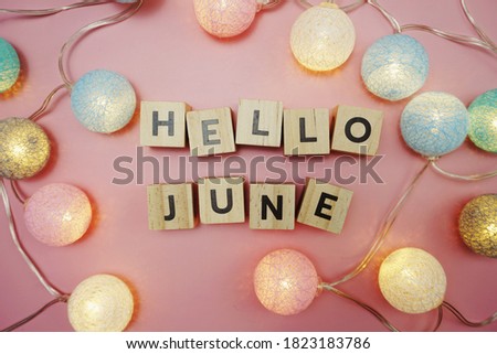 Hello June alphabet letter with space copy on pink background