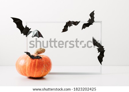 Halloween holiday concept. Photo frame, halloween decorations on white background. Front view, copy space

