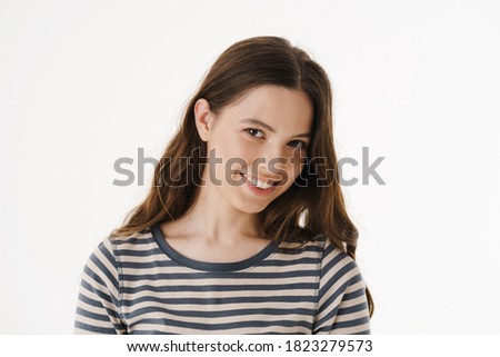 Pretty young smiling woman wearing casual clothes isolated over white background