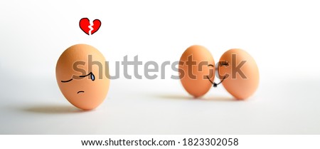 A broken heart brown egg with crying face. A couple brown egg falling in love on white background. Easter eggs and Egg cartoon face Concept.