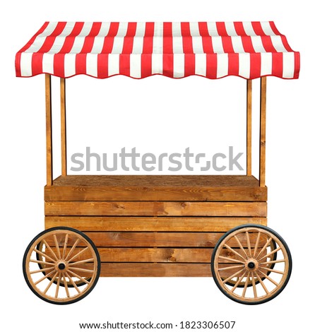 Mobile street market stand stall with wheels and red white striped awning Royalty-Free Stock Photo #1823306507