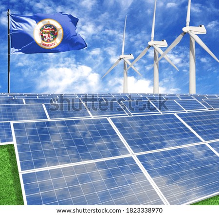 Solar panels on the background of a flagpole with the flag State of Minnesota and Wind Turbine