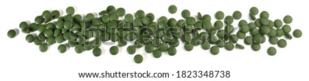 Chlorella Pills with Case Panorama - used for depression, fibromyalgia, high cholesterol and others. Isolated on white Background.