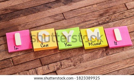 
Colorful square papers with wooden white letters for the acronym word ICYMI means In Case You Missed It Royalty-Free Stock Photo #1823389925