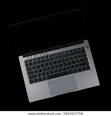 white mockup on laptop screen isolated on black background close up