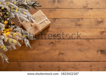 gift box on rough wooden floor. New Year or Christmas background. Greeting card