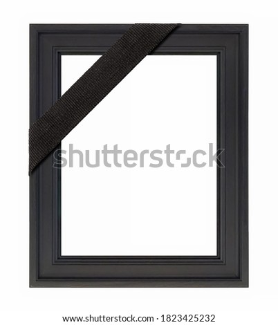 Black wooden frame with black mourning ribbon for paintings, mirrors or photo isolated on white background